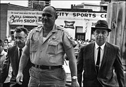 250px Lawrence Rainey flanked by FBI agents