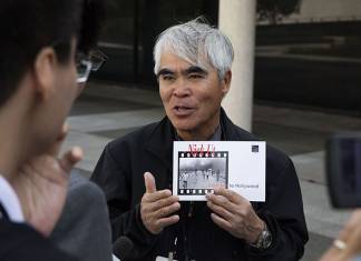 Nick Ut speaks with the press