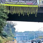 BringThemHomeNow banner over highway