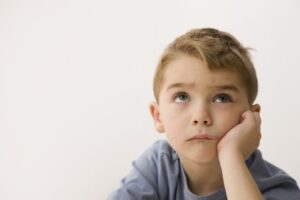 bored caucasian boy looking up royalty free image 1692199098
