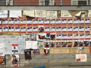 Kidnapped posters with photographs of the hostages and missing 6
