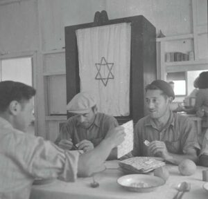 A Passover Meal in the Dining Hall of Kibbutz Hafetz Haim in the 1940s. Photo Credit Yaakov Rosner KKL JNF Photo Archive