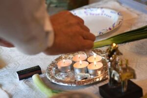 rabbi joe charnes lights a candle as the passover seder 0d0b54